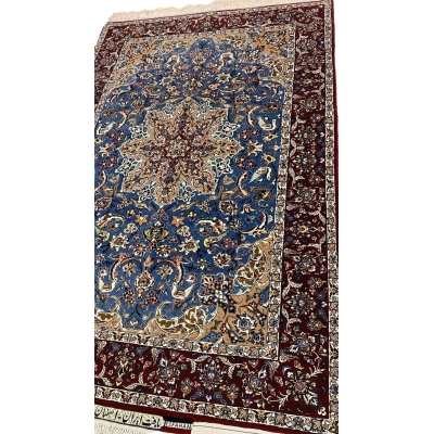 "Elegant Persian Seirafian rug with a floral medallion design in shades of blue, beige, and burgundy, crafted with silk and wool."