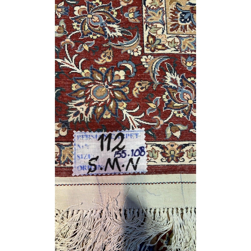 "Backside of a hand-knotted Seirafian Persian rug, highlighting the fine silk warp and precise craftsmanship typical of Isfahan rugs."