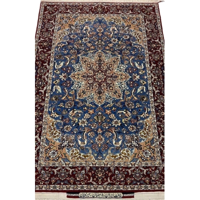 "Hand-knotted Seirafian Persian rug with intricate blue and beige floral patterns, made from wool and silk, showcasing Isfahan craftsmanship."