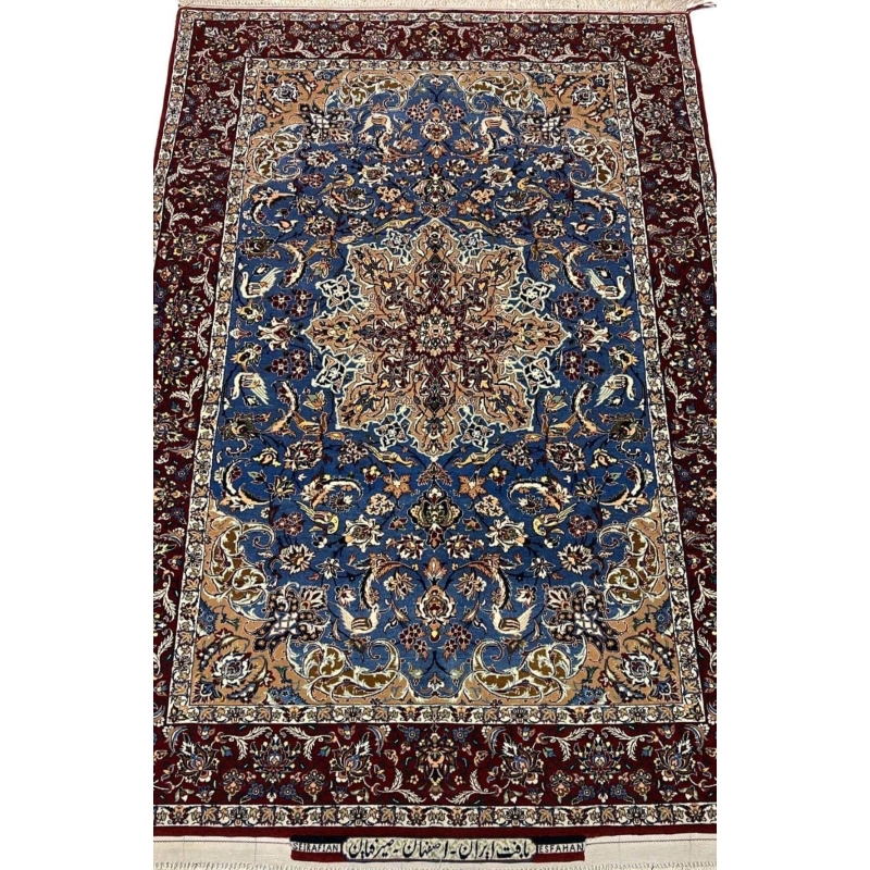 "Hand-knotted Seirafian Persian rug with intricate blue and beige floral patterns, made from wool and silk, showcasing Isfahan craftsmanship."