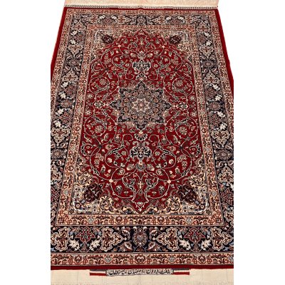 "Hand-knotted Seirafian Persian rug with red medallion design, made from silk and wool, measuring 5.7x3.5 ft, crafted in Isfahan by master weaver Bagher Seirafian."