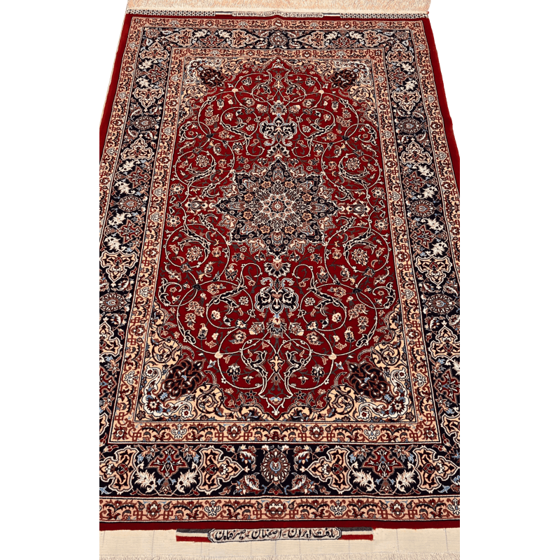 "Hand-knotted Seirafian Persian rug with red medallion design, made from silk and wool, measuring 5.7x3.5 ft, crafted in Isfahan by master weaver Bagher Seirafian."