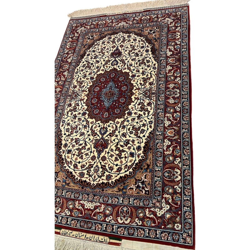 "Close-up view of a handmade Seirafian Persian rug, showing the fine knotting, luxurious wool and silk blend, and floral motifs."