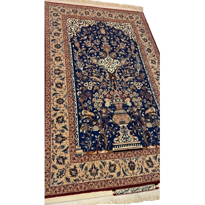 "Close-up of the detailed floral patterns on a hand-knotted silk and wool Seirafian rug by Master Mohammad Ali Seirafian."