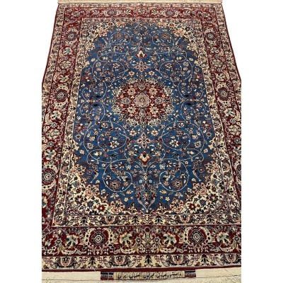"Hand-knotted vintage Seirafian Persian rug by Master Sadegh Seirafian, featuring intricate floral patterns in blue, red, and ivory, crafted in Isfahan."