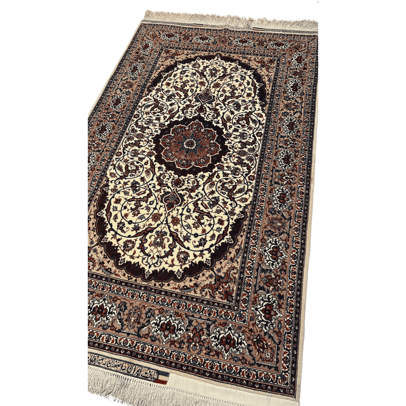 "Close-up of a fine Persian silk and wool carpet with medallion design, mastercrafted by Bagher Seirafian, showing rich colors and intricate knotting."