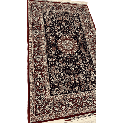 "Angled view of a hand-knotted Persian carpet by Master Bagher Seirafian, showcasing floral motifs and a classical Persian design."