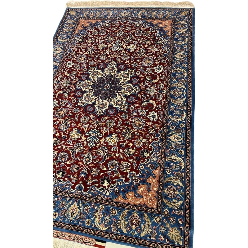 "Close-up of a Seirafian Isfahan rug with floral design, showing detailed hand-knotted craftsmanship in silk and wool."