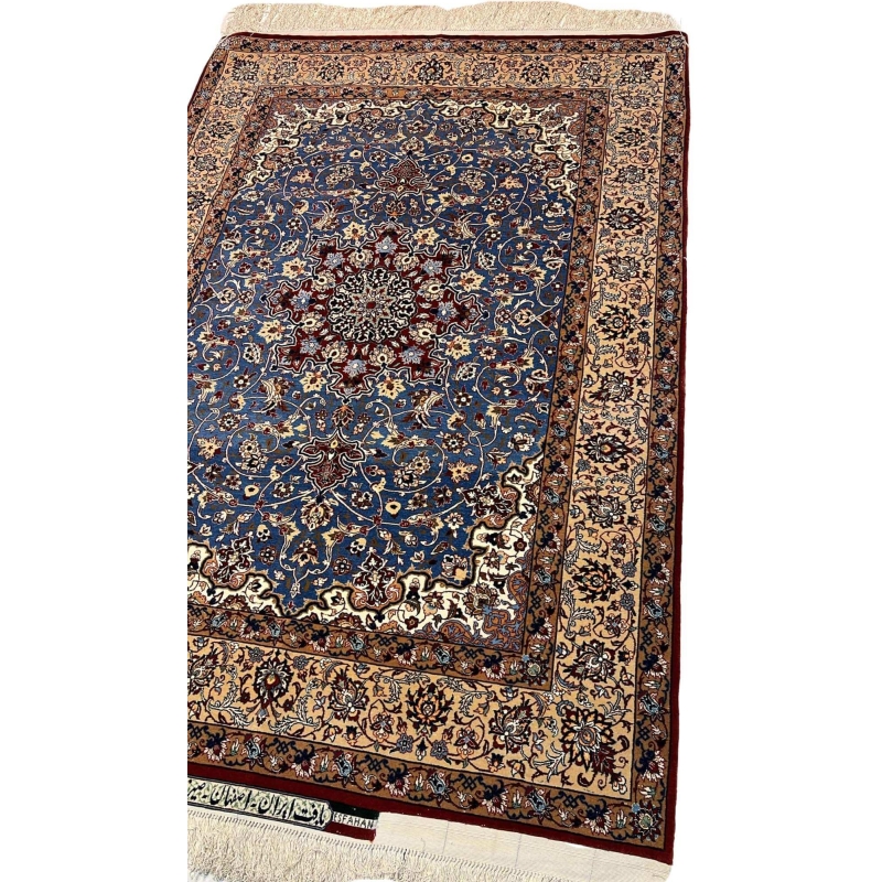 "Detailed close-up of the floral patterns on a Seirafian Persian rug, showcasing hand-knotted wool and silk craftsmanship from Isfahan, Iran."