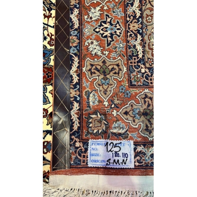 "Backside view of a hand-knotted Seirafian rug, highlighting the fine knotting and silk warp for durability."