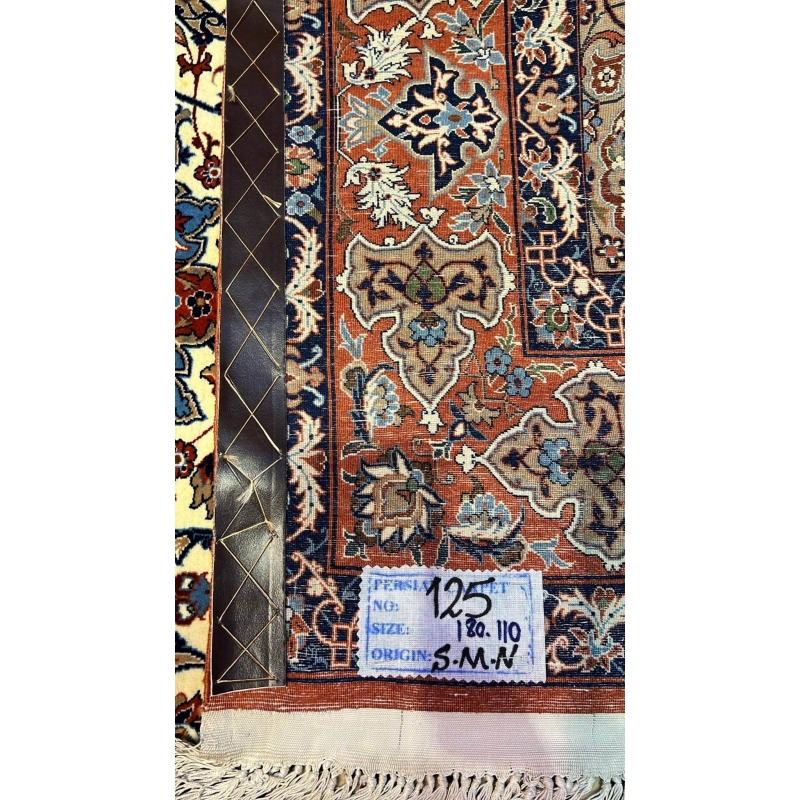 "Backside view of a hand-knotted Seirafian rug, highlighting the fine knotting and silk warp for durability."