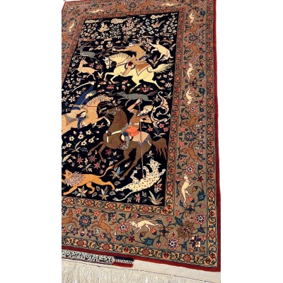 Detail shot of the hand-woven Seirafian rug’s hunting scene, capturing the fine detail and artistry of Persian craftsmanship.
