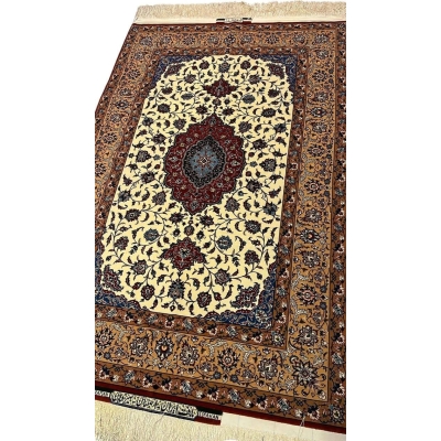 "Close-up of a Seirafian floral Persian rug by Ali Reza Seirafian, highlighting the central medallion and delicate floral motifs in natural dyes."