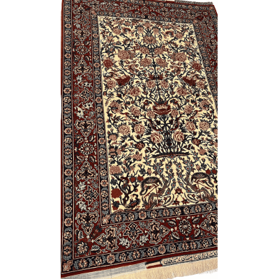 "Close-up of the intricate floral design on a Seirafian Persian rug by Master Bagher Seirafian, showcasing fine knotting and vibrant colors."