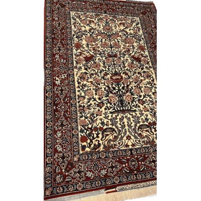 "Close-up of the intricate floral design on a Seirafian Persian rug by Master Bagher Seirafian, showcasing fine knotting and vibrant colors."