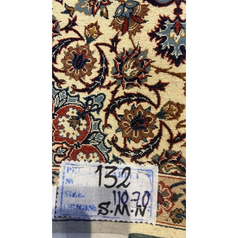 Backside view of the authentic small beige Seirafian rug, revealing fine knotting craftsmanship and silk foundation.