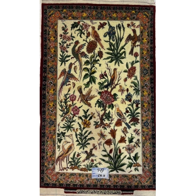 "Hand-knotted small Persian rug by Master Hassan Seirafian, 110x75 cm, featuring a floral and bird design in wool and silk."