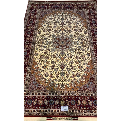 "Hand-knotted Isfahan rug by Seirafian featuring a medallion design with floral motifs."
