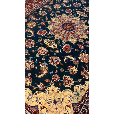 "50-year-old Persian rug featuring a medallion design and intricate floral patterns."