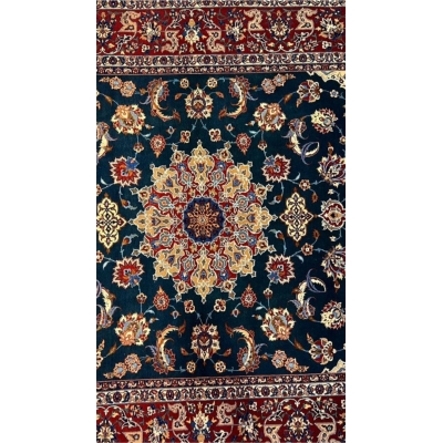 "Close-up of floral motifs and arabesques on a vintage Isfahan rug."