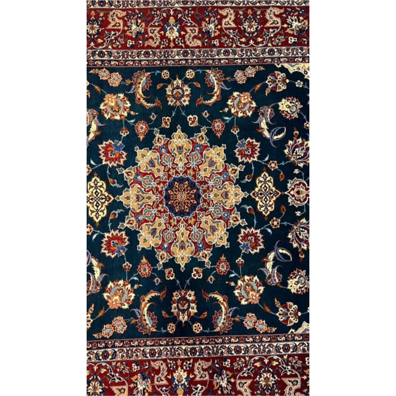 "Close-up of floral motifs and arabesques on a vintage Isfahan rug."