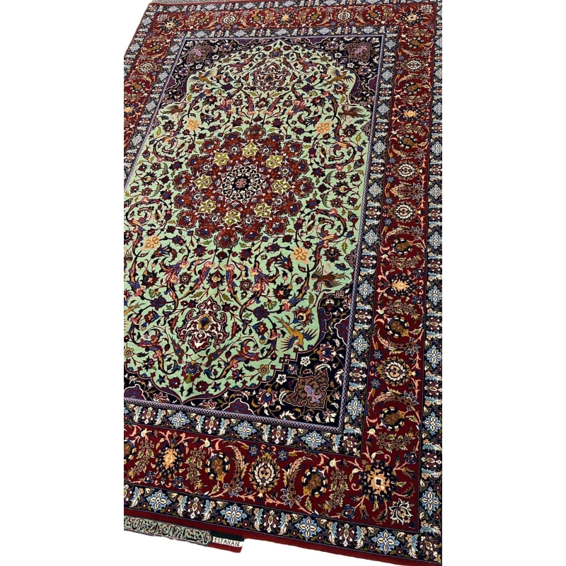 "Side view of an exclusive Seirafian wool and silk rug, showcasing detailed floral motifs and a luxurious finish."