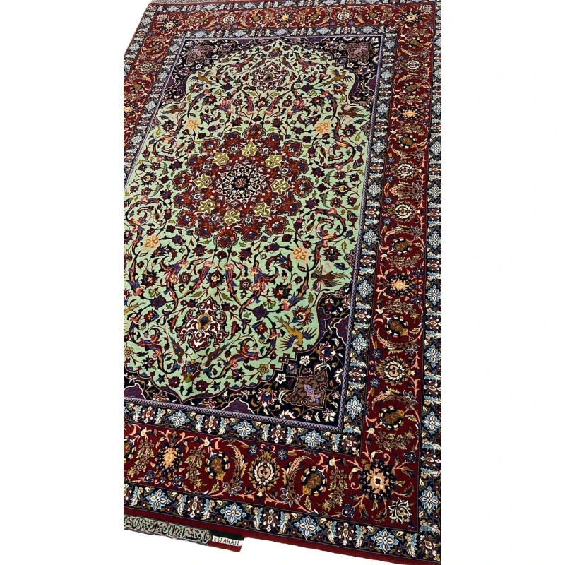 "Side view of an exclusive Seirafian wool and silk rug, showcasing detailed floral motifs and a luxurious finish."