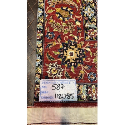 "Backside of a Seirafian hand-knotted rug, highlighting the fine knotting and silk warp, ensuring durability and authenticity."