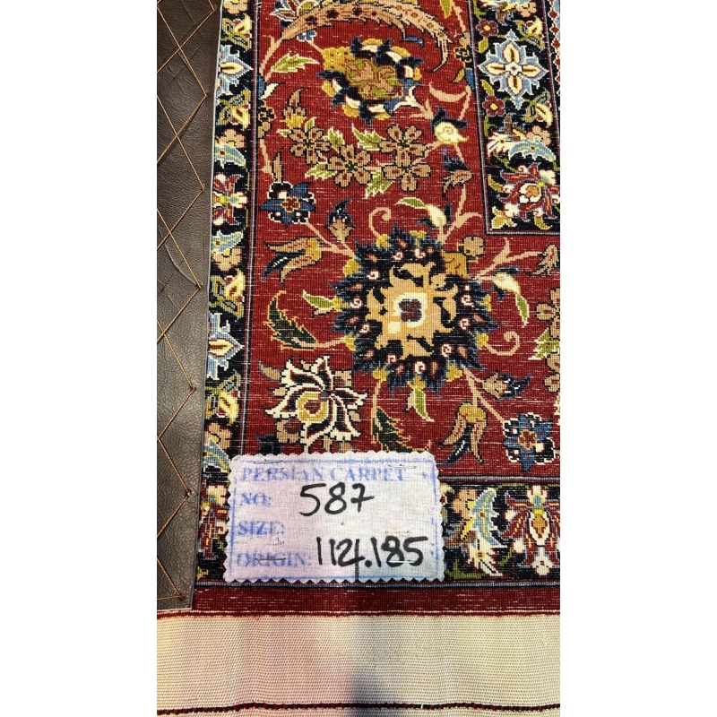 "Backside of a Seirafian hand-knotted rug, highlighting the fine knotting and silk warp, ensuring durability and authenticity."