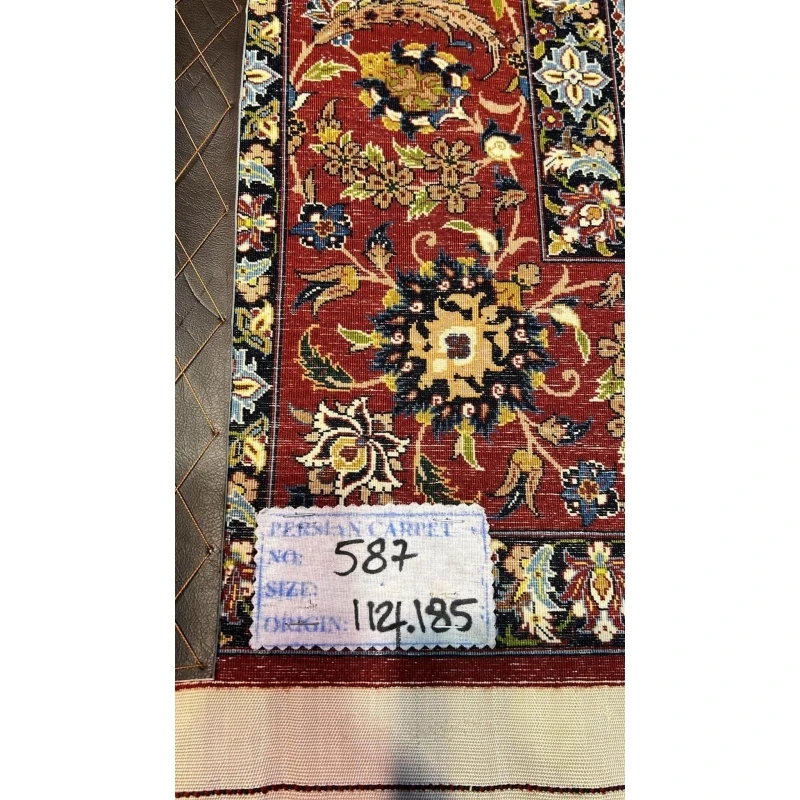 "Backside of a Seirafian hand-knotted rug, highlighting the fine knotting and silk warp, ensuring durability and authenticity."