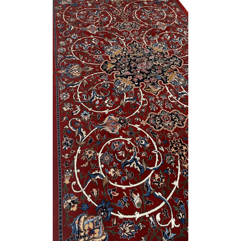 "Luxurious Persian rug woven by master artisan Bagher Seirafian in Isfahan, Iran. This 189 x 105 cm (6.2 x 3.4 feet) rug is handcrafted with a wool and silk pile and a silk warp. It boasts a stunning floral design with a knot density of 1,210,000 knots per square meter, ensuring its high quality and durability. A rare collectible piece weighing 5 kg, available in stock."