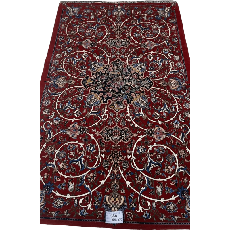 "Exquisite Isfahan Persian rug by master weaver Bagher Seirafian. Measuring 189 x 105 cm (approximately 6.2 x 3.4 feet) with a thickness of 5 mm and a remarkable knot density of 1,210,000 knots per square meter. This handcrafted masterpiece features intricate floral designs on a deep red background, with a luxurious wool and silk pile and a silk warp. This new rug from Isfahan, Iran, weighs 5 kg and is an exclusive piece."
