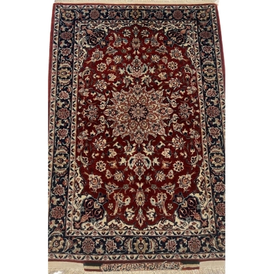 Semi-antique small Seirafian black and red Persian rug showcasing intricate floral designs and bold colors.