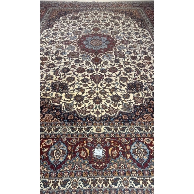 "Handwoven Isfahan rug by Master Hamid Seirafian, featuring intricate floral patterns on an ivory background."