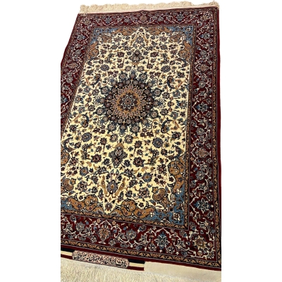 "Exquisite Isfahan Seirafian rug in shades of beige and burgundy, handwoven with wool and silk for luxury and durability."