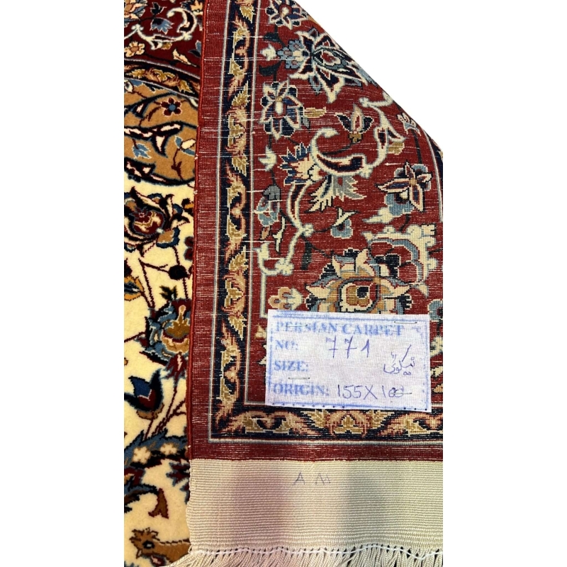 "Backside of a handwoven Seirafian Persian rug, showcasing the detailed silk warp and craftsmanship from Isfahan, Iran."