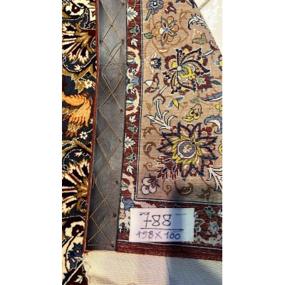 "Backside of a hand-knotted Seirafian Persian rug, revealing the intricate silk warp and craftsmanship by Master Hassan Seirafian."