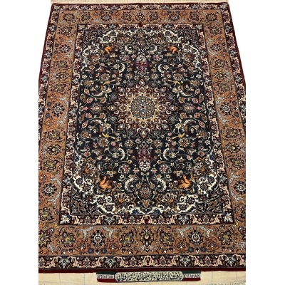 "Hand-knotted Hassan Seirafian Persian rug with silk and wool blend, featuring intricate floral and medallion design."
