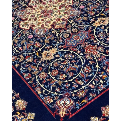 "Isfahan rug with navy blue base and vibrant floral medallion by Bagher Seirafian."