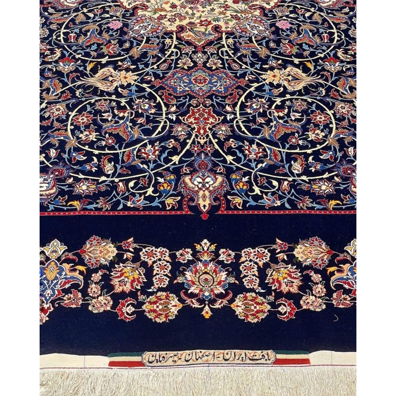 "Timeless navy blue Persian rug, handmade in Isfahan with natural dyes."