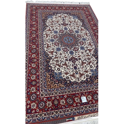 A detailed side view of the Genuine 5 x 7 Red and Beige Seirafian Persian rug, showcasing its intricate hand-knotted texture, luxurious wool and silk pile, and fine craftsmanship by Grand Master Karim Seirafian.