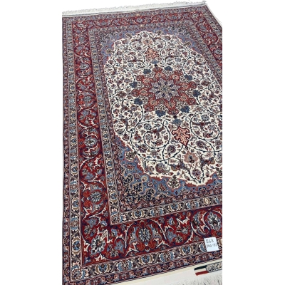 "Close-up of intricate floral motifs on a wool and silk Persian rug with a high knot density of 1,440,000 knots/m²."
