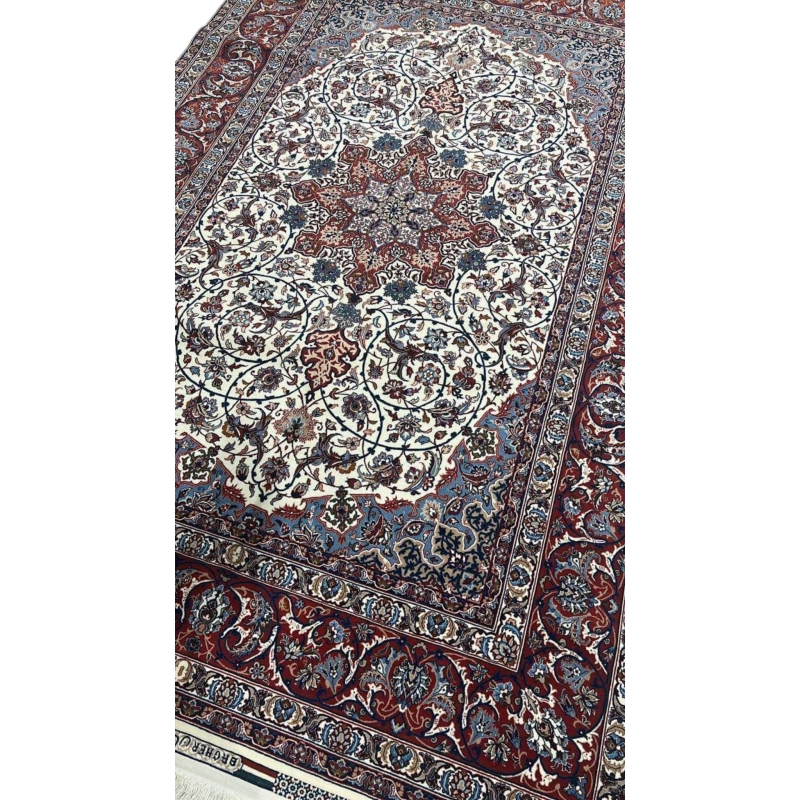 "Luxurious Persian rug featuring a star medallion and detailed floral patterns, hand-knotted in Isfahan, Iran."