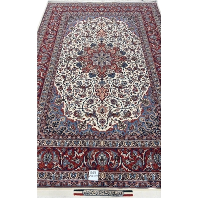 "Hand-knotted Isfahan rug with star medallion design in cream, red, and blue, crafted by Master Bagher Seirafian."

