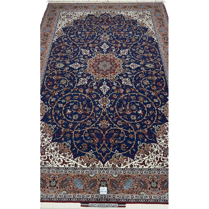 "Hand-knotted Isfahan rug by Hassan Seirafian featuring a navy blue field with floral patterns."