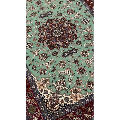Mint green Seirafian rug with fine floral details, ideal for collectors or home decor.