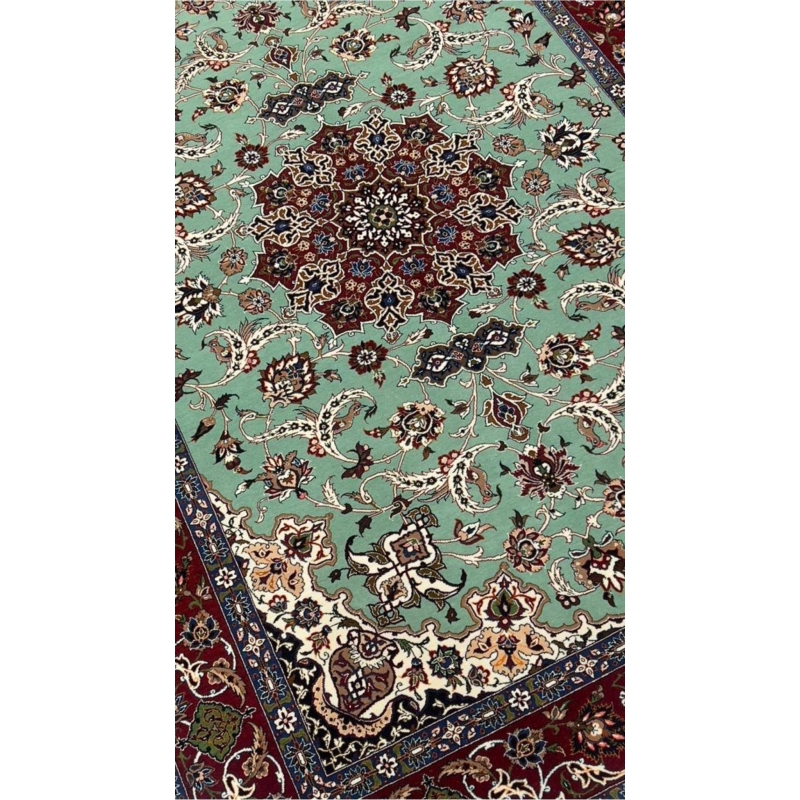 Mint green Seirafian rug with fine floral details, ideal for collectors or home decor.