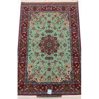 Hand-knotted Seirafian Persian rug with mint green and crimson red accents.
