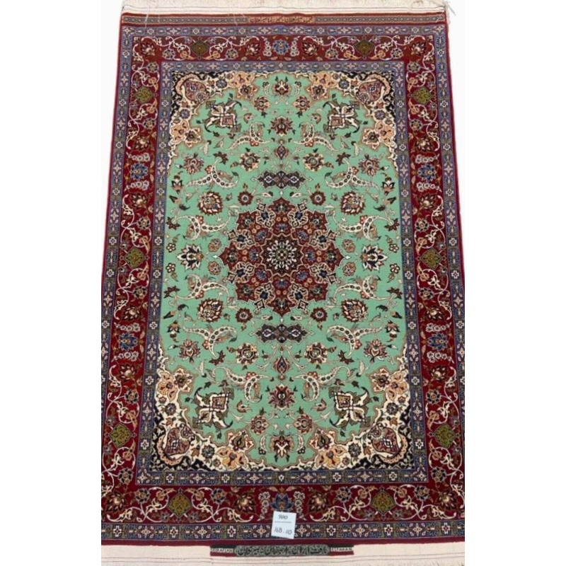 Hand-knotted Seirafian Persian rug with mint green and crimson red accents.