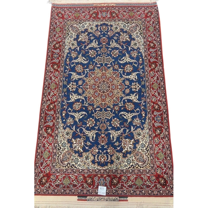 Hand-knotted Persian Seirafian rug with a deep blue medallion and red border.